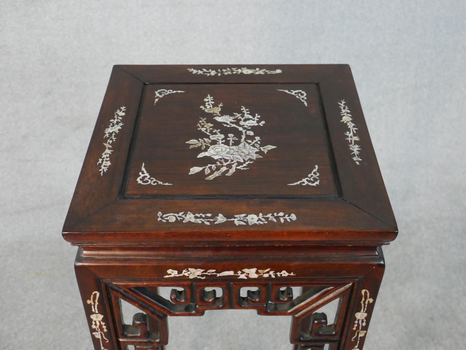 A Chinese carved and pierced hardwood urn stand inlaid with mother of pearl bird and floral - Image 5 of 5