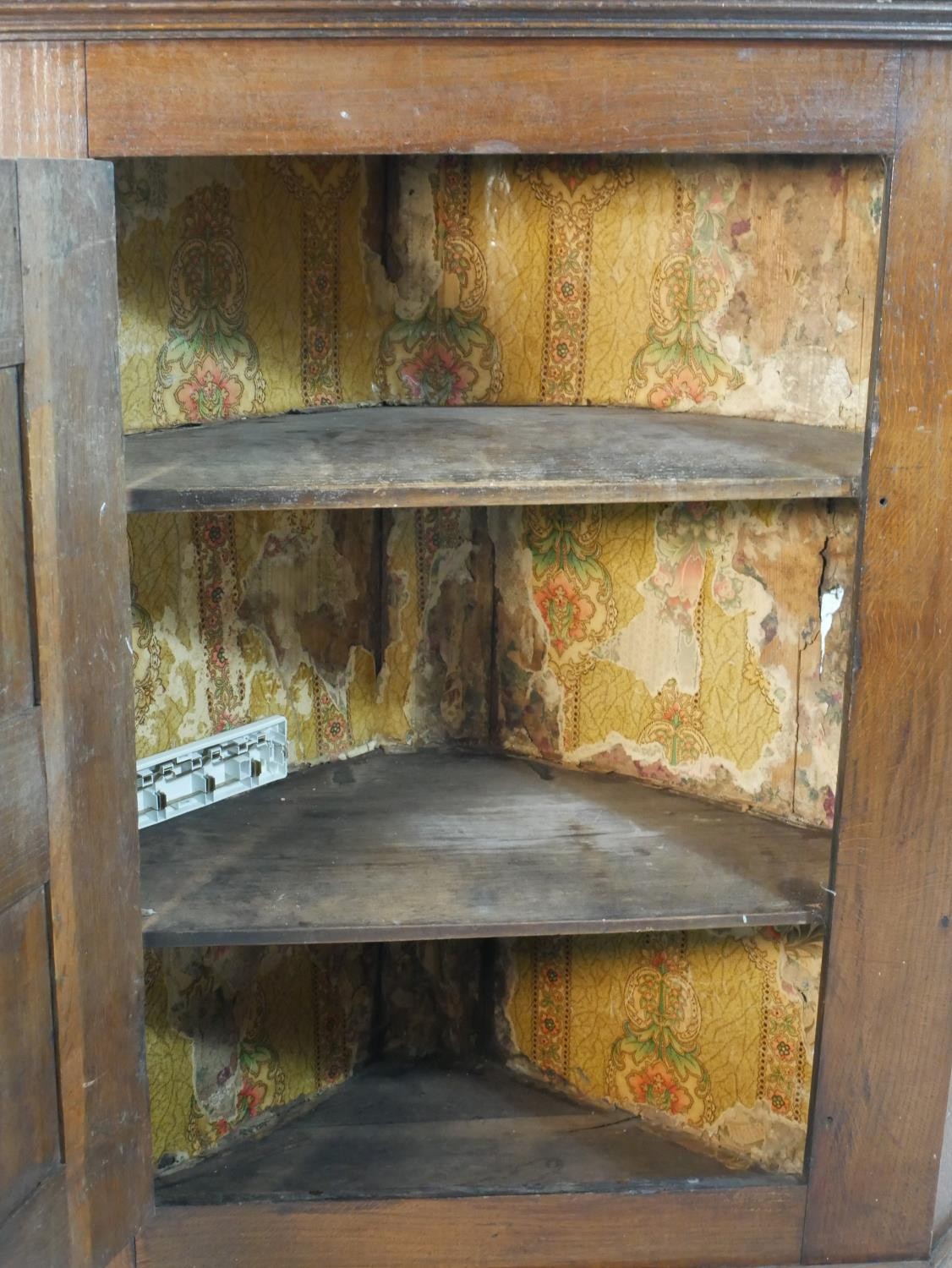 A 19th century oak hanging corner cabinet with panel door enclosing two shelves. H.106 W.94.5 W.46cm - Image 5 of 5
