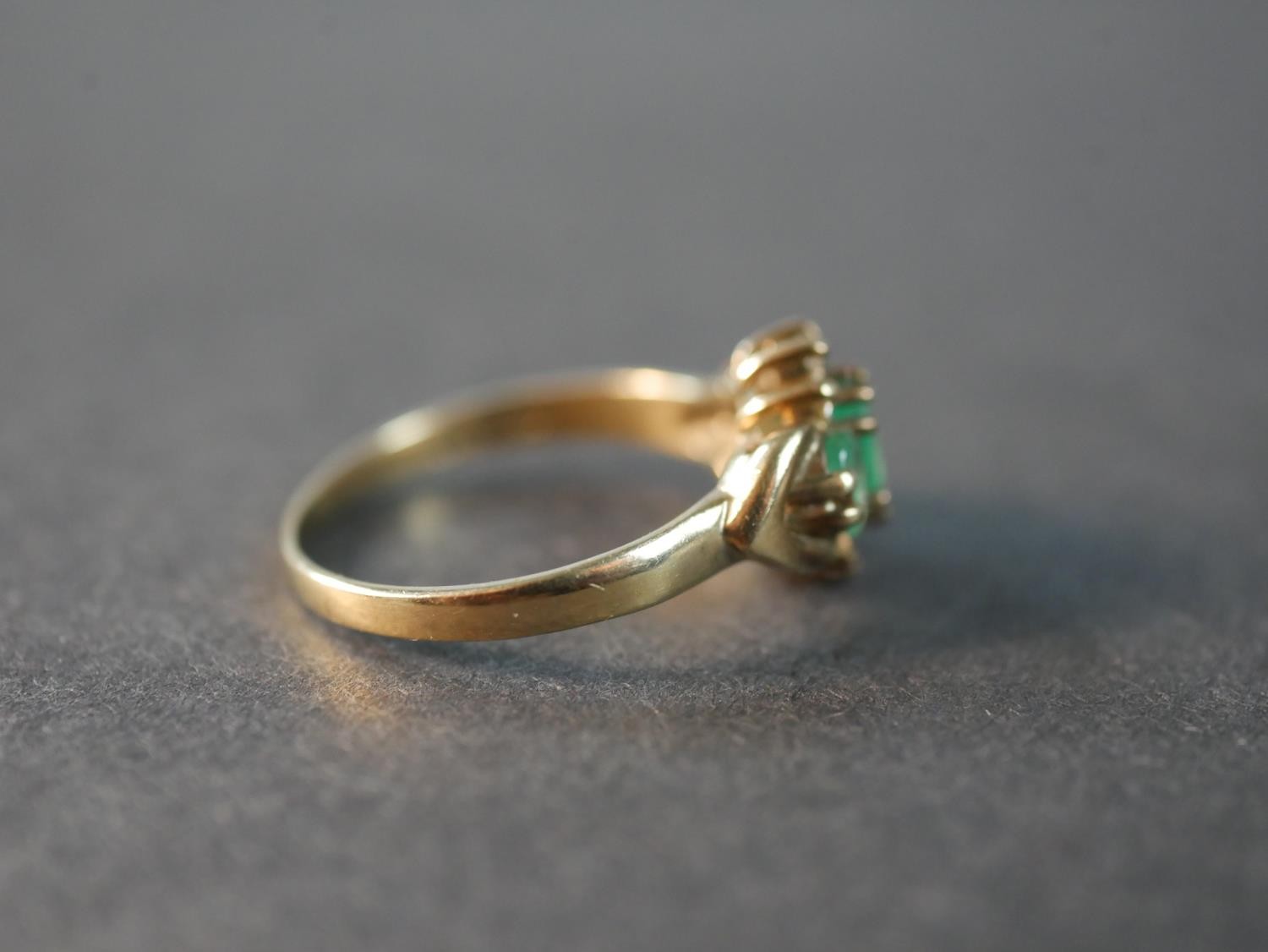 A 9 carat yellow gold emerald and diamond three stone ring, set with three oval mixed cut emeralds - Image 3 of 5