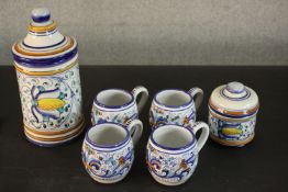 A four person hand painted ceramic Deruta Italian coffee set with sugar bowl and storage jar.