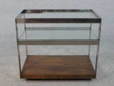 A vintage Merrow Associates chrome and hardwood cocktail trolley with two plate glass tiers. H.63