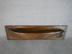 An early 20th century carved wall mounted hull of a boat. H.26 W.96cm