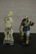 A carved Chinese soapstone figure of a female deity along with a hand painted clay figure of a