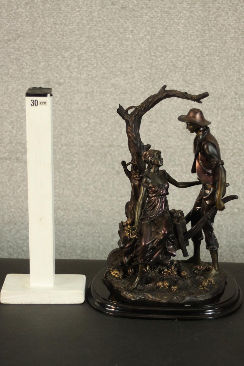 A Leonardo Collection bronze resin figure group of a young couple with a wheelbarrow under a tree. - Image 2 of 9
