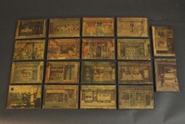 A collection of eighteen plywood plaques of Victorian shop fronts. H.12 W.8cm. (each)