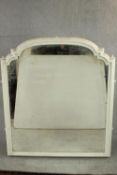 An arched overmantel mirror with a white painted moulded frame. H.137 W.125cm.