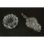 A crystal Orrefors berry design candle holder along with a bunch of grape form bottle with