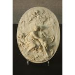 A relief Classical style moulded plaque depicting a pair of seated gods with flying putti, one