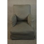 A small armchair, with a grey fabric cover.