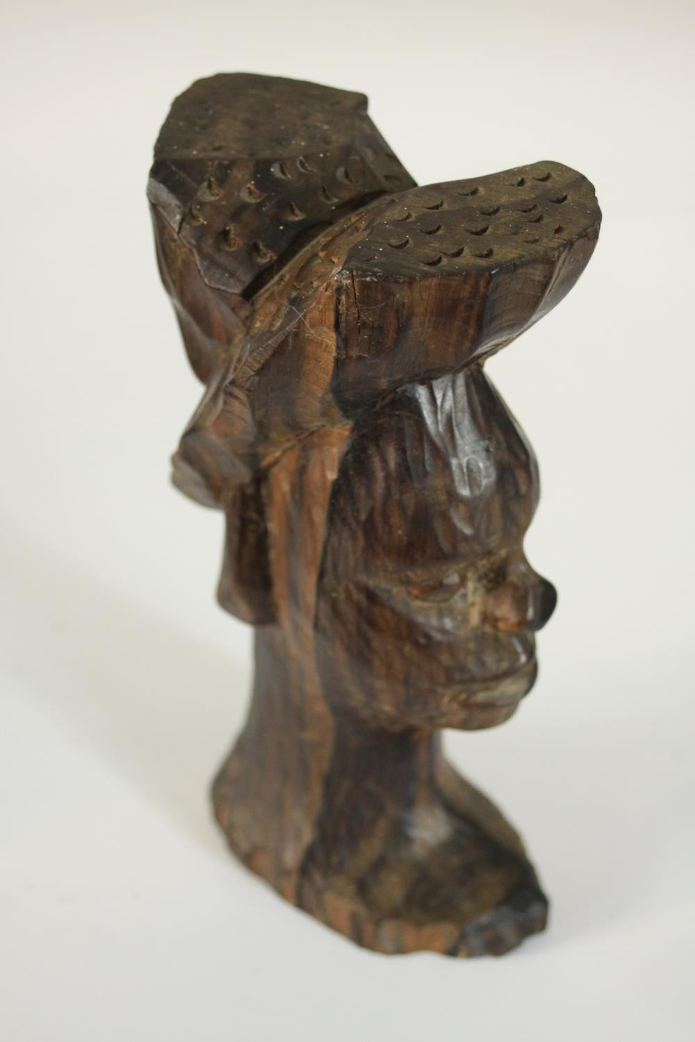 A carved African tribal mask along with a carved male bust in a hat and a double headed mask. H.27 - Image 6 of 8