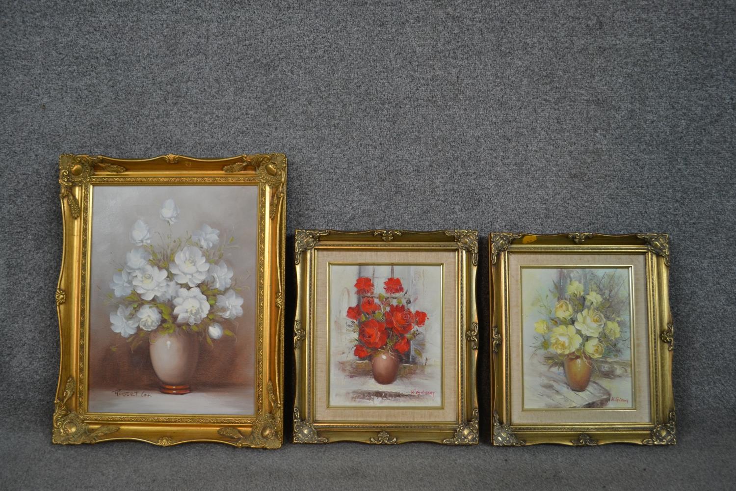 Three framed oils on canvas of vases of flowers, two Kay Gilbert and one Robert Cox. H.50 W.40cm (