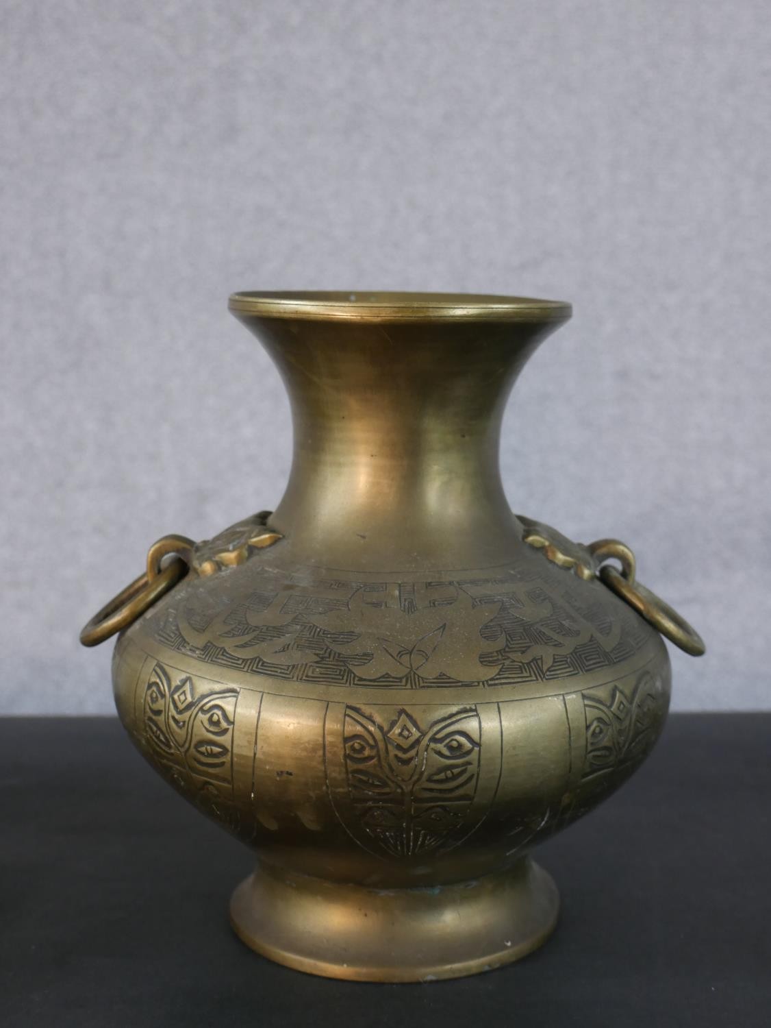 A pair of 20th century engraved twin handled Oriental brass vases. (handle loose) H.22.5 W.20cm - Image 2 of 5