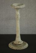 A Victorian cast iron pricket candlestick, white painted and distressed. H.45 Dia.20cm.