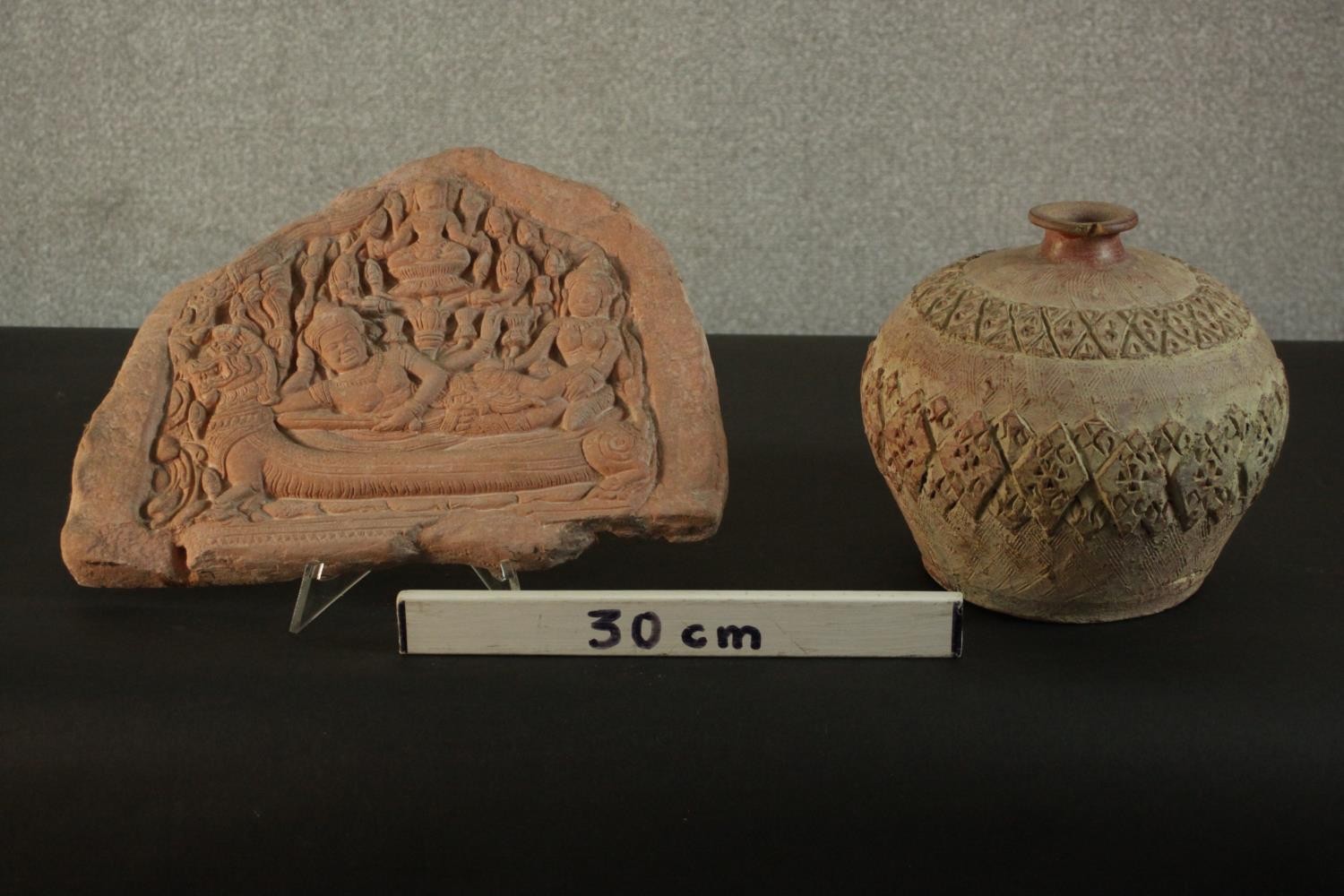 A relief clay tablet depicting Indian deities along with a ceramic vase with incised geometric - Image 2 of 9