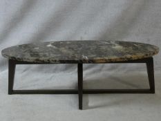 A vintage coffee table with floating marble top on cross stretchered base. H.44 L.136 W.57cm