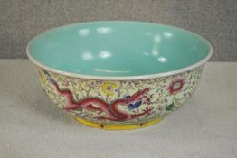 A large early 20th century Chinese porcelain bowl, celadon glaze to the interior and the outside