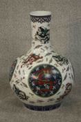 A large Chinese Ming style porcelain vase of bulbous form decorated with dragon and floral motifs,
