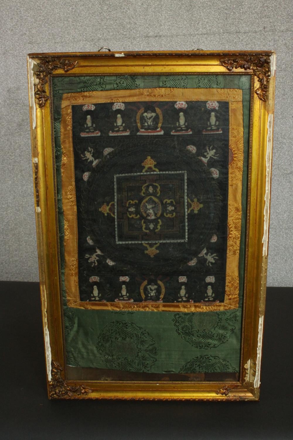 An early 20th century Tibetan hand painted thangka with mandala and silk brocade border. H.70 W. - Image 3 of 6