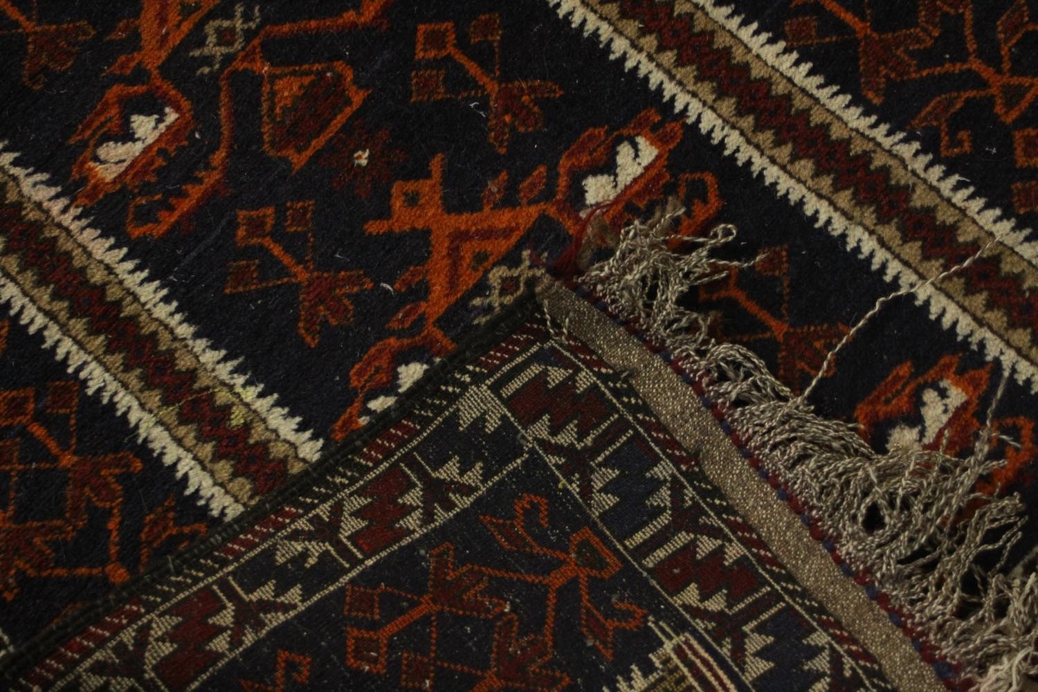 A hand made black ground Belouch rug. L.140 W.75cm. - Image 3 of 3