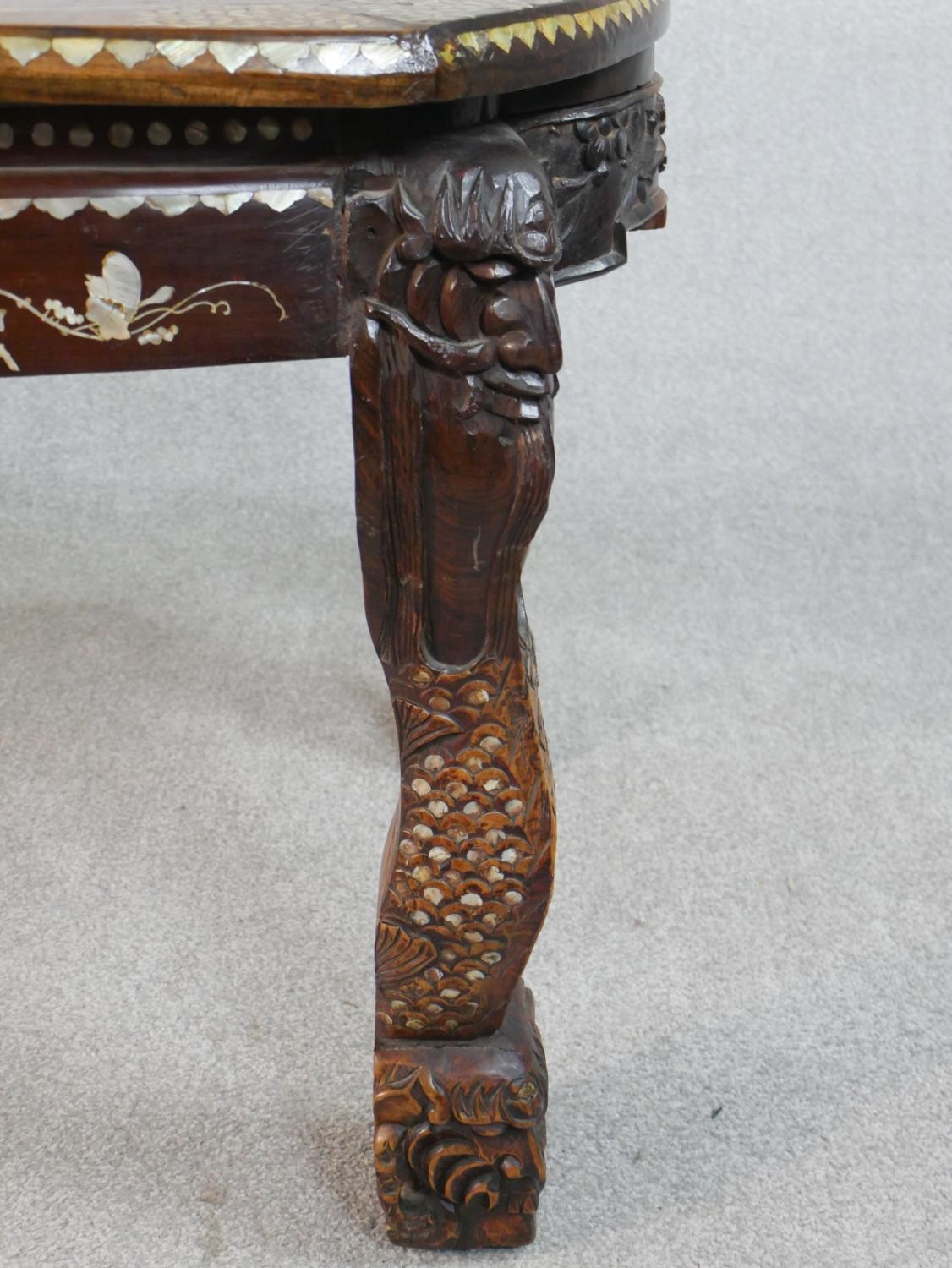 An early 20th century Chinese hardwood table with carved figural legs, all over inlaid with a mother - Image 5 of 8