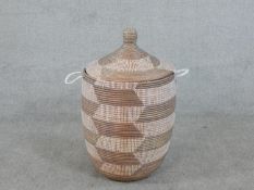 A woven geometric design two colour laundry basket. H.70 Diam.43cm