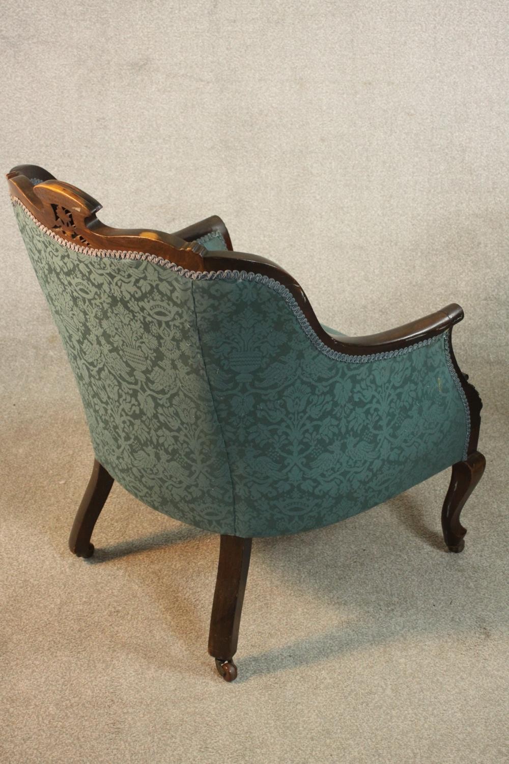 A pair of Edwardian walnut tub armchairs, upholstered in buttoned blue damask, with scrolling arms - Image 7 of 10