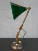 An early 20th century industrial steel and brass desk lamp, with a conical green enamelled shade
