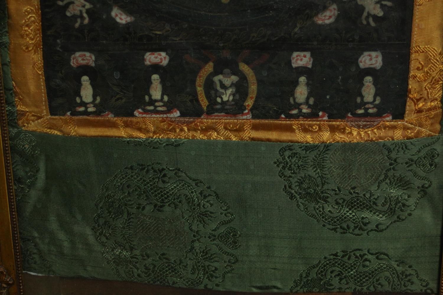 An early 20th century Tibetan hand painted thangka with mandala and silk brocade border. H.70 W. - Image 5 of 6