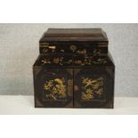 A Japanese black lacquered tabletop jewellery cabinet, decorated with birds and foliage, the