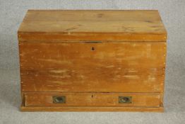 A 19th century pine campaign mule chest, with a rising lid and fitted rack, over a long drawer