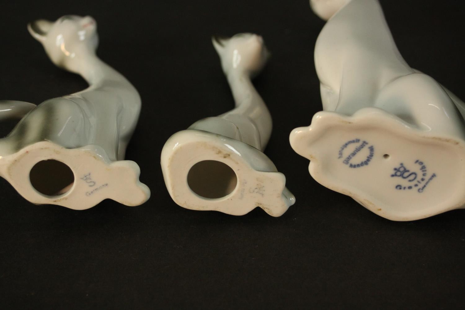 Three German porcelain Siamese cats in three different sizes, makers mark to base. H.18 W.9 D.7cm. - Image 6 of 6