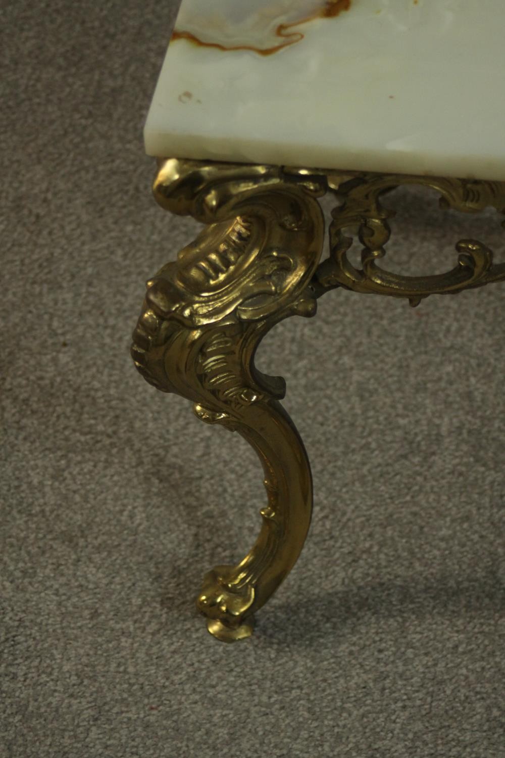 A Rococo style brass coffee table, the rectangular onyx top with a moulded edge, the base with a - Image 4 of 5