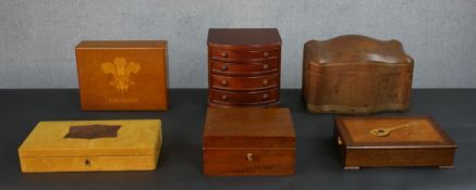 A collection of five boxes and a miniature chest of drawers. A Harrods mustard suede jewellery