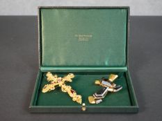 Two large vintage Christian Lacroix cross form statement brooches, one set with red paste stones and