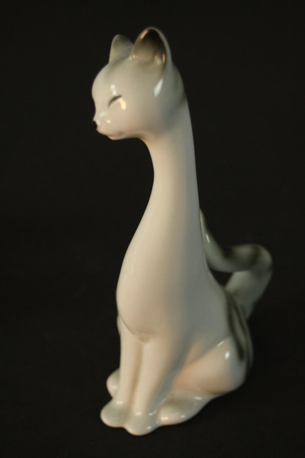 Three German porcelain Siamese cats in three different sizes, makers mark to base. H.18 W.9 D.7cm. - Image 5 of 6