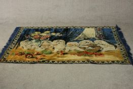 A machine made tapestry wall hanging depicting a group of curious cats and kittens. L.186 W.