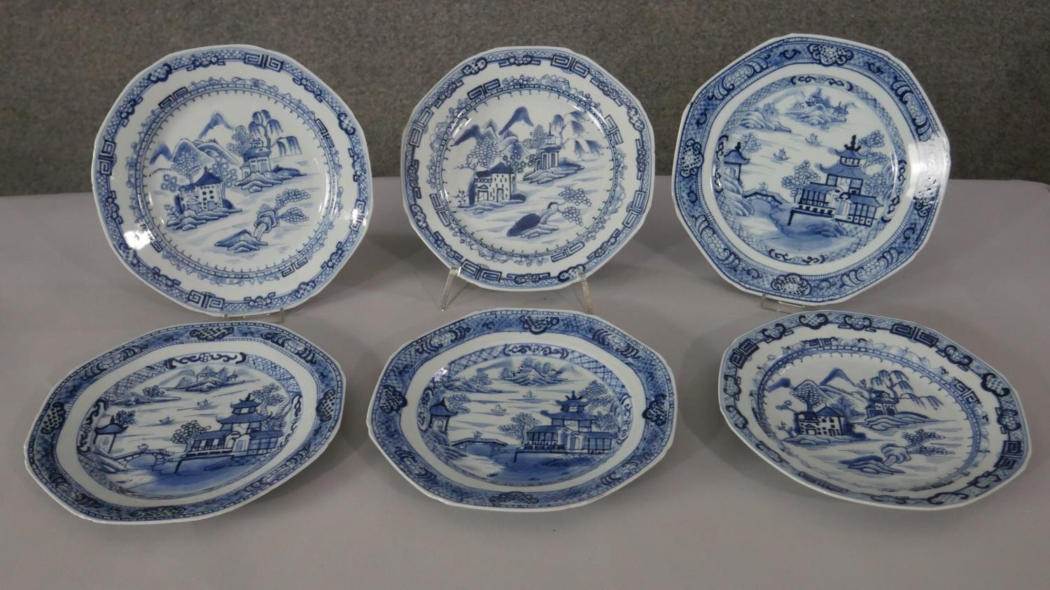 Six 18th century Chinese export blue and white hand painted porcelain octagonal dishes decorated