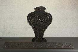 An oak stair baluster and furniture mount, probably 17th century, one with two opposing spirals