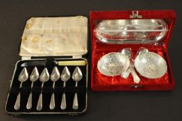 A collection of silver plate, including a set of six grapefruit spoons and a silver plated
