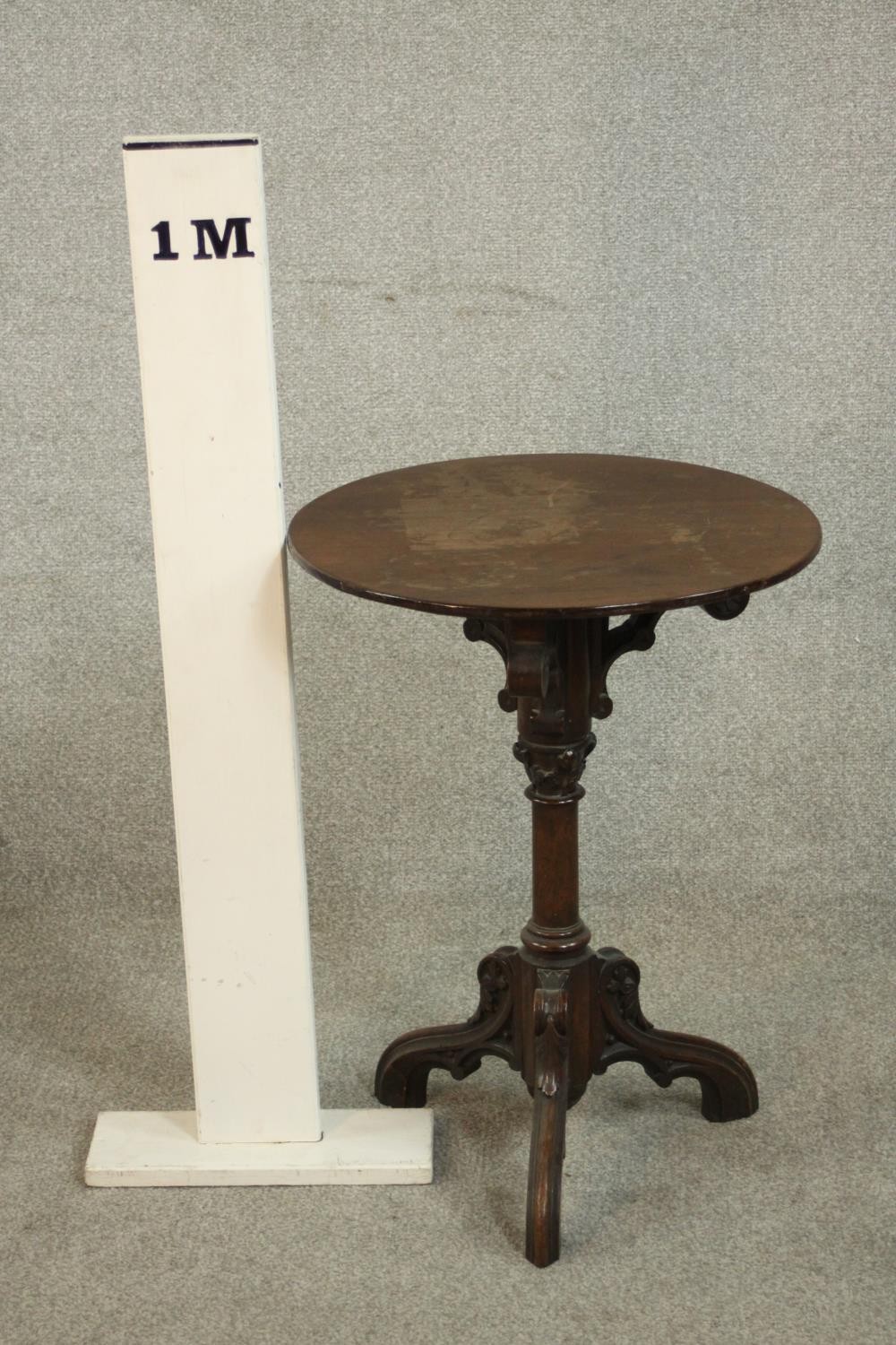 A Victorian ecclesiastical mahogany occasional table, with a circular top supported by carved - Image 2 of 6