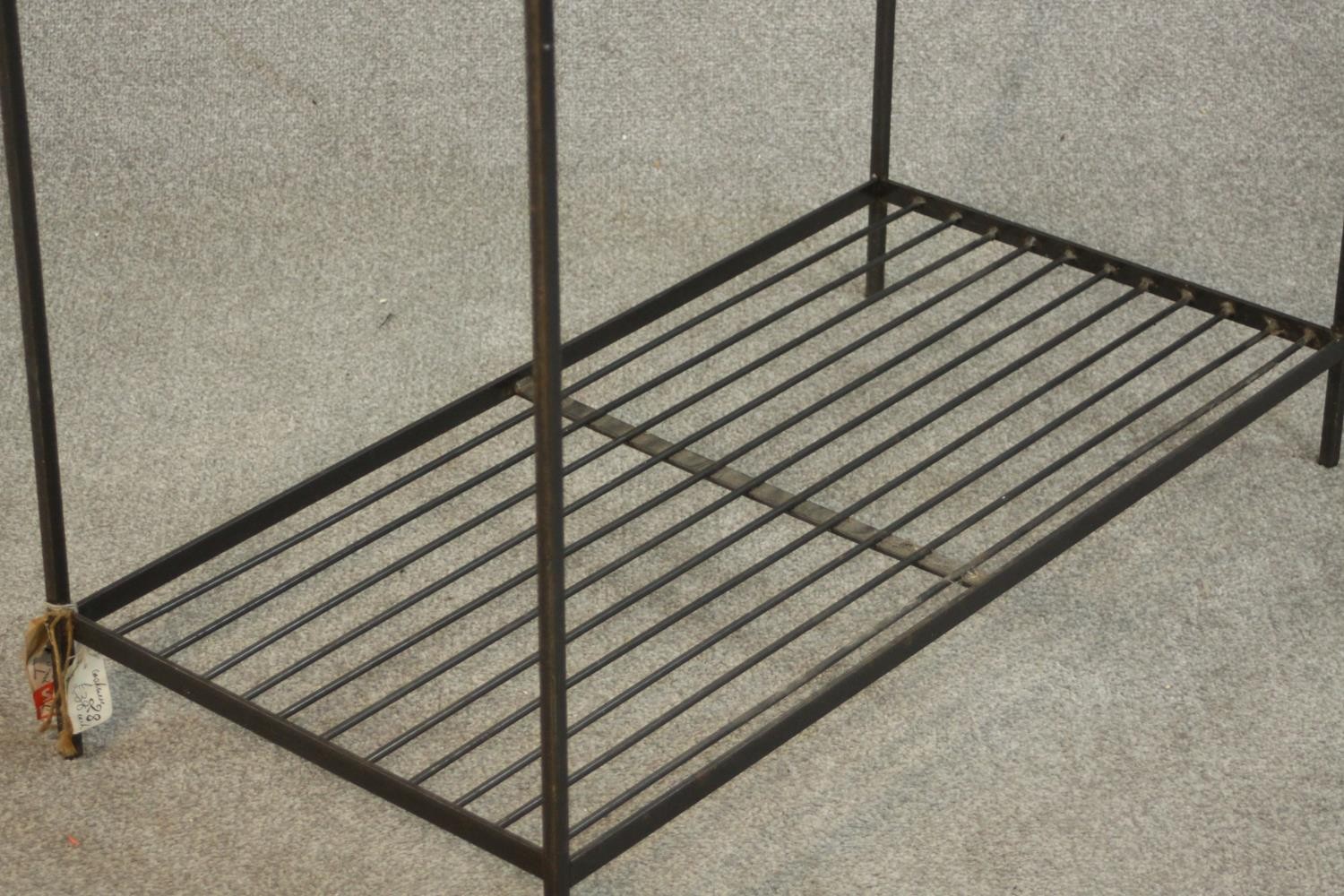 A wrought iron industrial rack, with a rail suspended from below a shelf, over another shelf to - Image 6 of 6