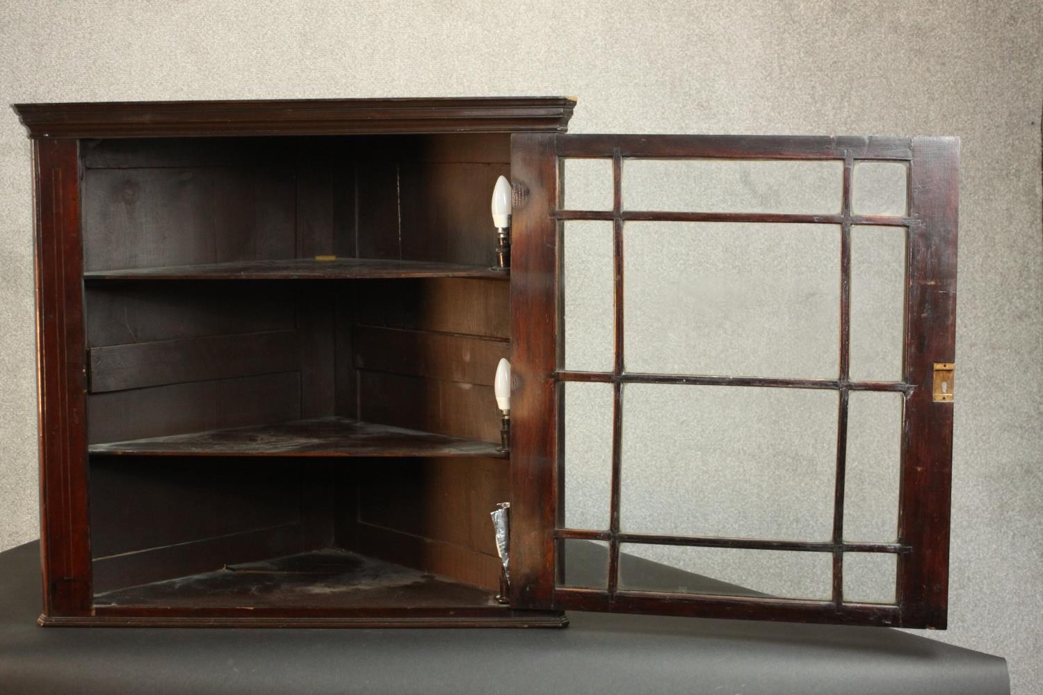 A George III mahogany corner cabinet, with a glazed door enclosing shelves. H.74 W.78 D.41cm. - Image 5 of 8