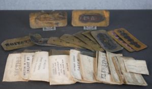 A large collection of Victorian brass calligraphy ink stencils. L.15 W.7cm (largest)