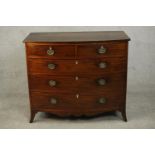A George III mahogany bow front chest, early 19th century, with two short over three long