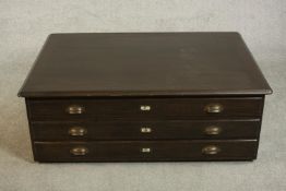 A 20th century stained ash plan chest section, with three long drawers. H.43 W.121 D.83cm.