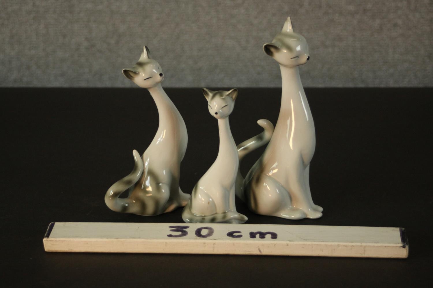 Three German porcelain Siamese cats in three different sizes, makers mark to base. H.18 W.9 D.7cm. - Image 2 of 6