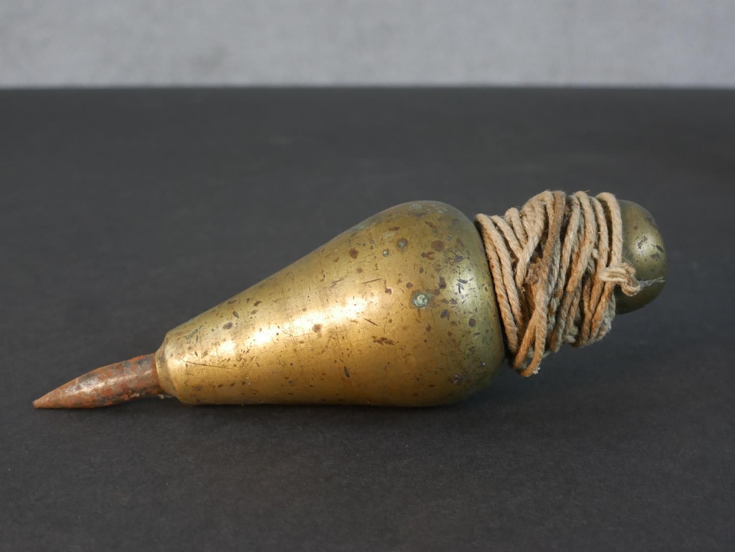 Two Victorian brass plumb lines, a silver plated putti form candle stick with engraved foliate - Image 5 of 6
