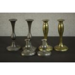 Three pairs of candle holders, two pairs of early 20th century pewter candlesticks and a pair of