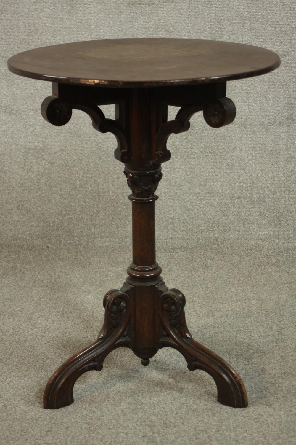 A Victorian ecclesiastical mahogany occasional table, with a circular top supported by carved - Image 4 of 6