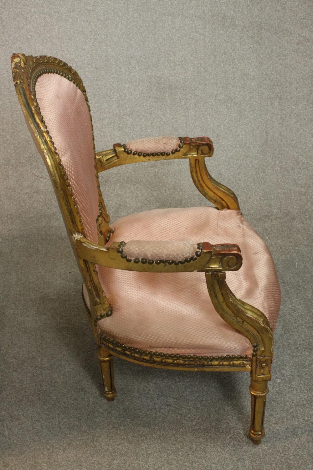 A pair of Louis XVI style giltwood fauteuil armchairs, upholstered in pink fabric to the back, - Image 8 of 12